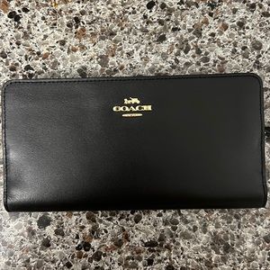 Coach wallet, black leather with gold hardware.